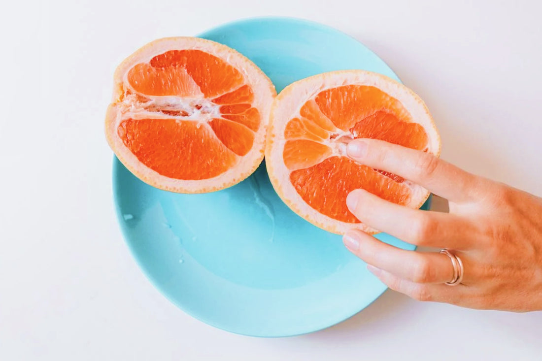  touching sliced orange fruit