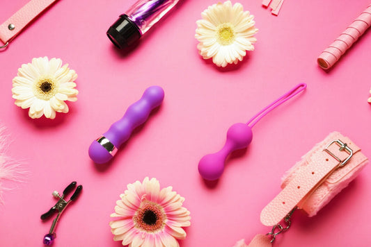 Many sex toys on pink background