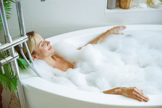 Women soaking in bathtubs